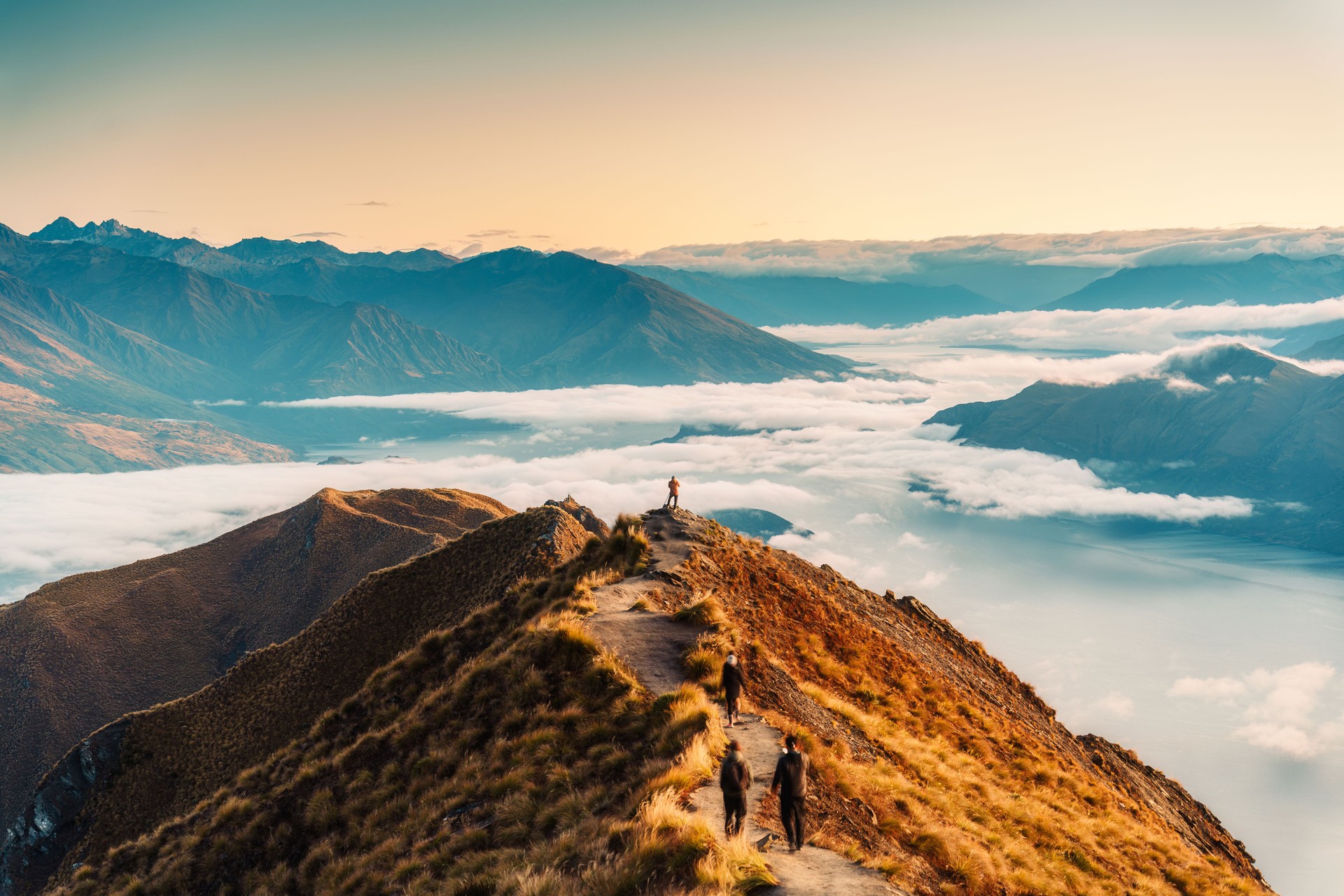 Climbing to top of mountain peak