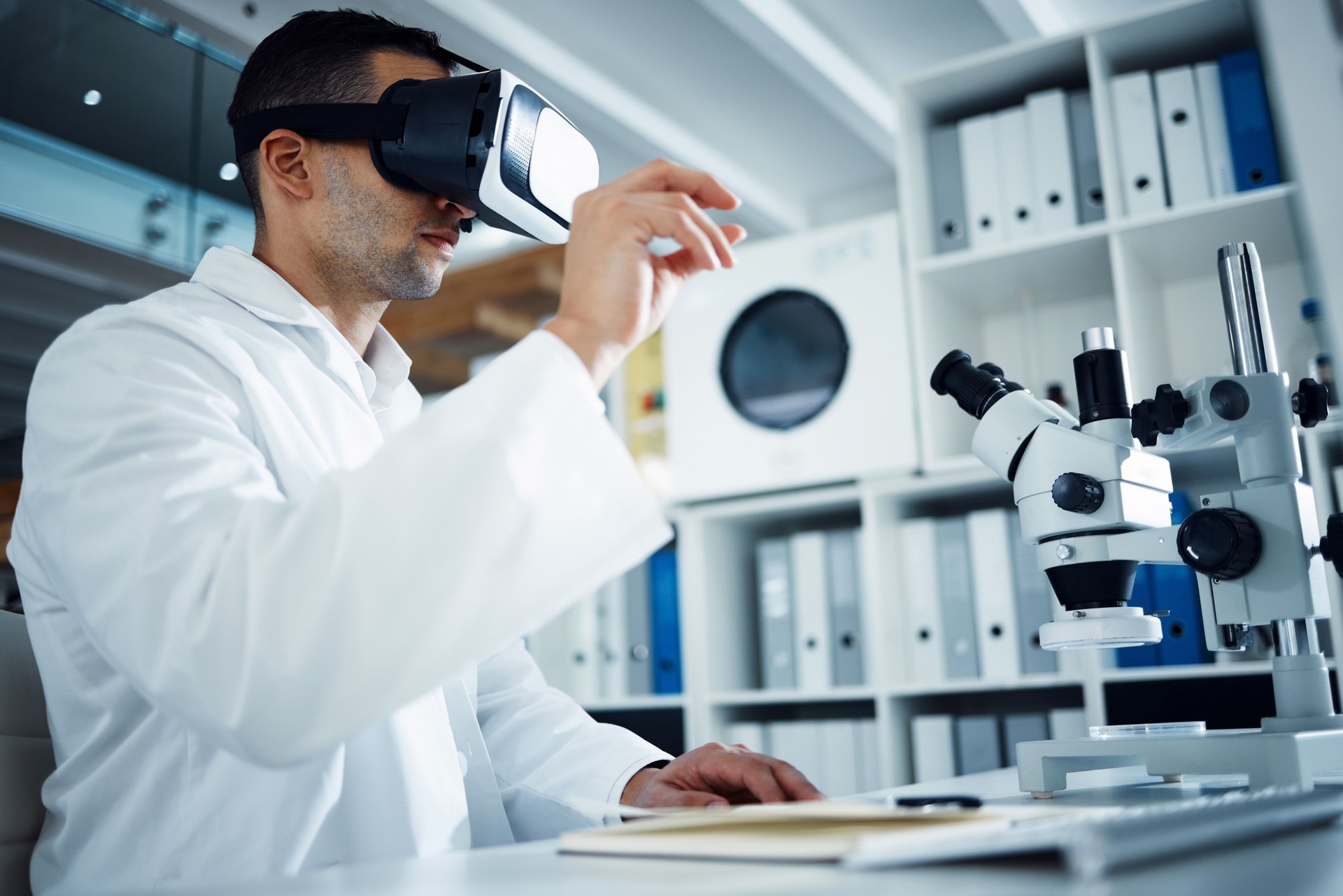 Scientist using virtual reality headset in modern biotechnology laboratory