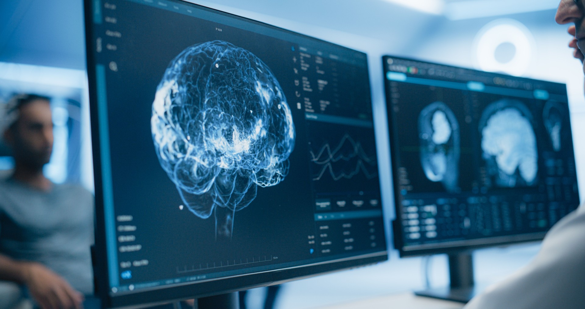 Medical brain scans on computer monitors showing innovative healthcare communication technology
