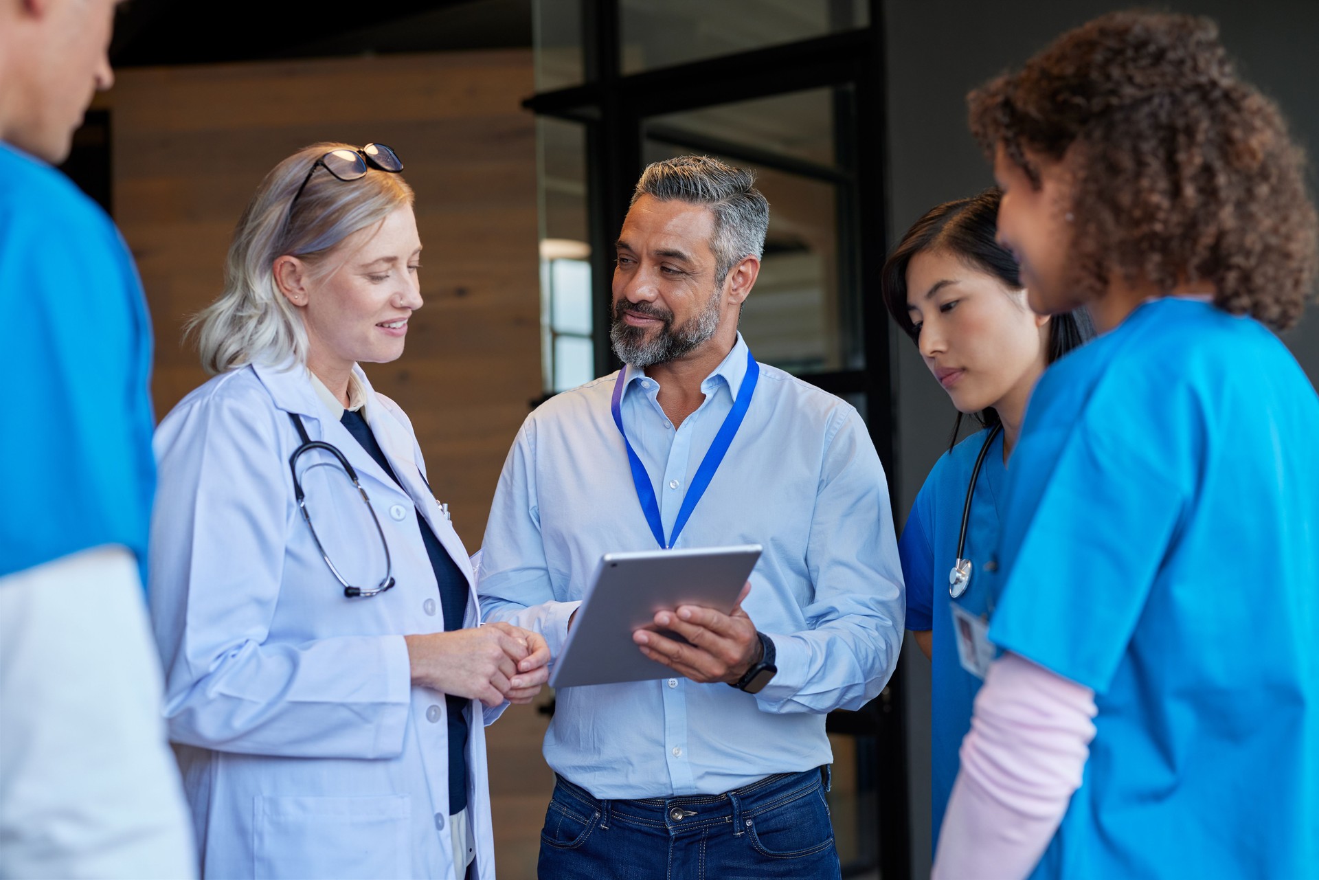 Pharmaceutical representative communicating with healthcare professionals in hospital setting